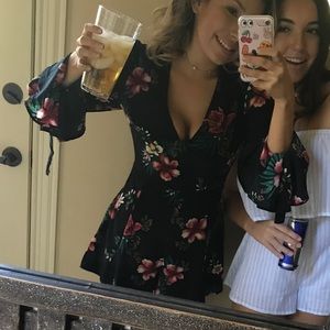 Floral long sleeve black romper!